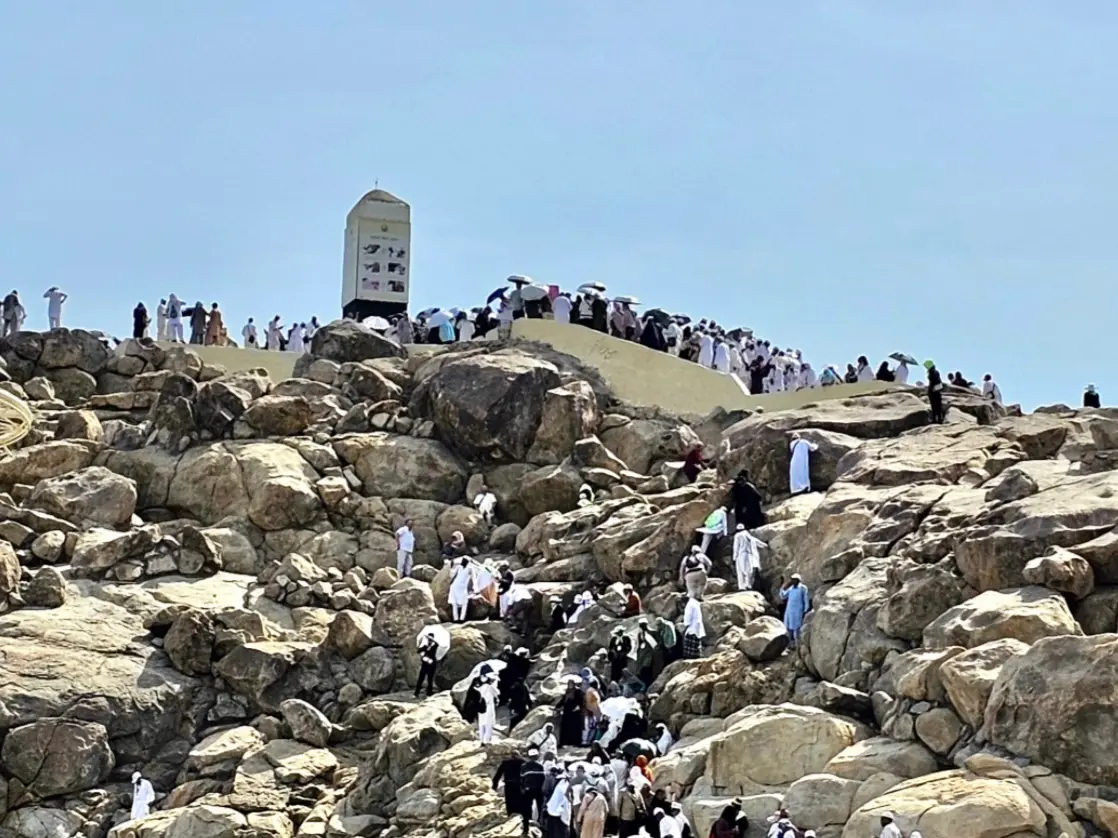 Pilgrims resting inside a Mina camp